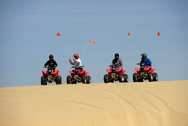 Four ATV's on the dunes